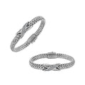 Sterling Silver woven bracelet featuring a polished push clasp and a sparkling Cubic Zirconia crisscross centerpiece, designed with durable construction and fine detailing for professional wholesale presentation.