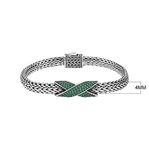 Sterling silver woven chain bracelet with purple Emerald Quartz crossover accent handcrafted in Bali.