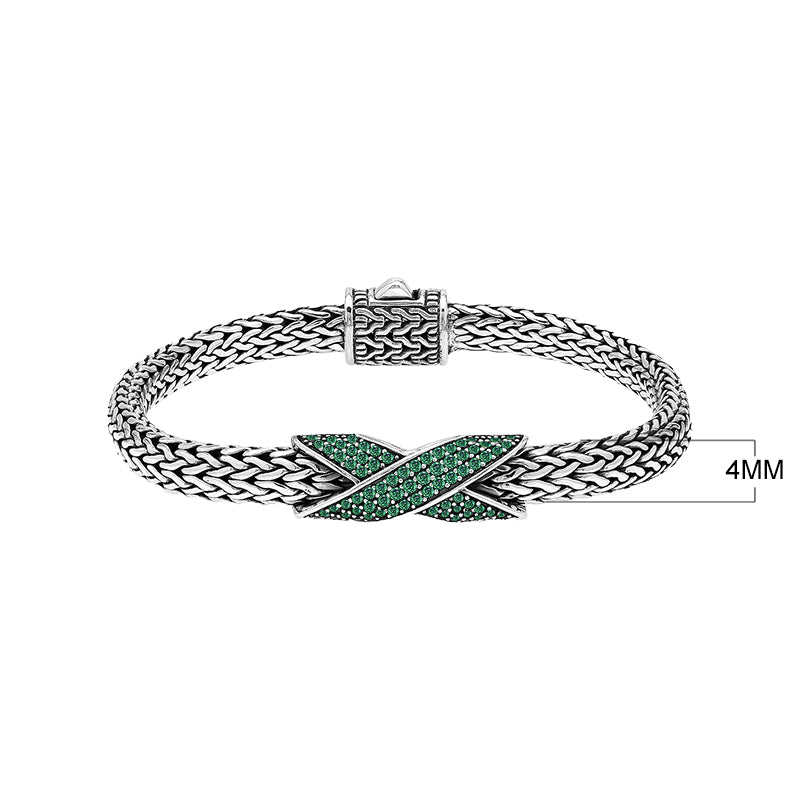 Sterling silver woven chain bracelet with purple Emerald Quartz crossover accent handcrafted in Bali.