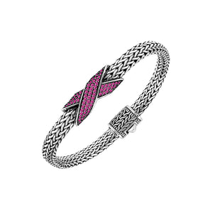 Sterling silver woven chain bracelet with purple Ruby Quartz crossover accent handcrafted in Bali.