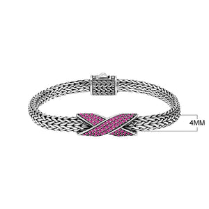 Sterling silver woven chain bracelet with purple Ruby Quartz crossover accent handcrafted in Bali.