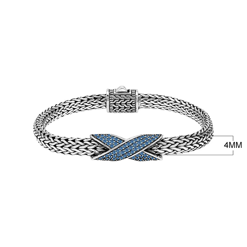 Sterling silver woven chain bracelet with purple Sapphire quartz crossover accent handcrafted in Bali.