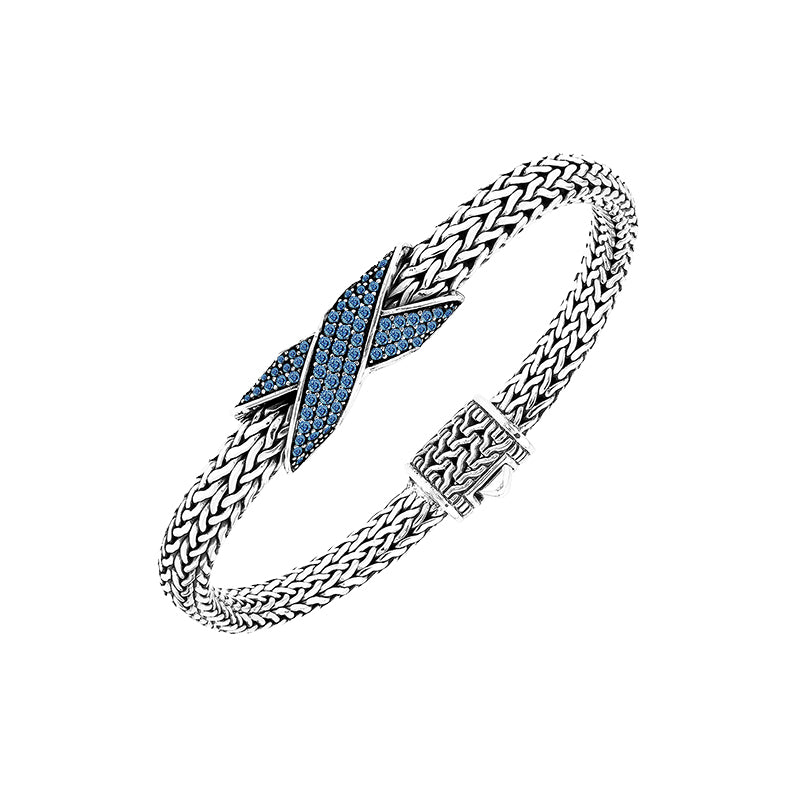 Sterling silver woven chain bracelet with purple Sapphire quartz crossover accent handcrafted in Bali.