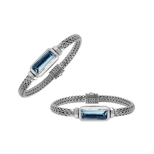 Sterling Silver woven bracelet featuring a polished push clasp and an elongated London Blue Topaz Quartz rectangular centerpiece, crafted with fine detailing for elegant and reliable wholesale presentation.