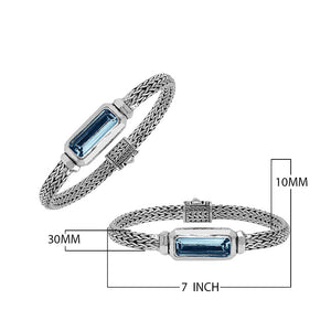 Sterling Silver woven bracelet featuring a polished push clasp and an elongated London Blue Topaz Quartz rectangular centerpiece, crafted with fine detailing for elegant and reliable wholesale presentation.