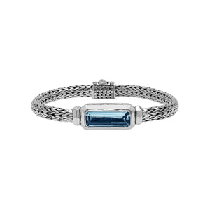 Sterling Silver woven bracelet featuring a polished push clasp and an elongated London Blue Topaz Quartz rectangular centerpiece, crafted with fine detailing for elegant and reliable wholesale presentation.