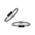 Sterling Silver woven bracelet featuring a polished push clasp and an elongated Black Onyx rectangular centerpiece, crafted with refined detailing for durable, elegant wholesale presentation.