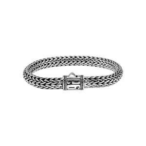 Sterling Silver woven bracelet featuring a patterned push lock and a polished high-gloss finish, crafted for durability and refined wholesale presentation.