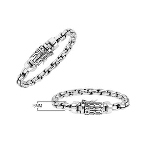 Sterling silver round braided link chain bracelet featuring substantial interwoven links, polished surfaces, oxidized accents, and an engraved decorative box clasp.