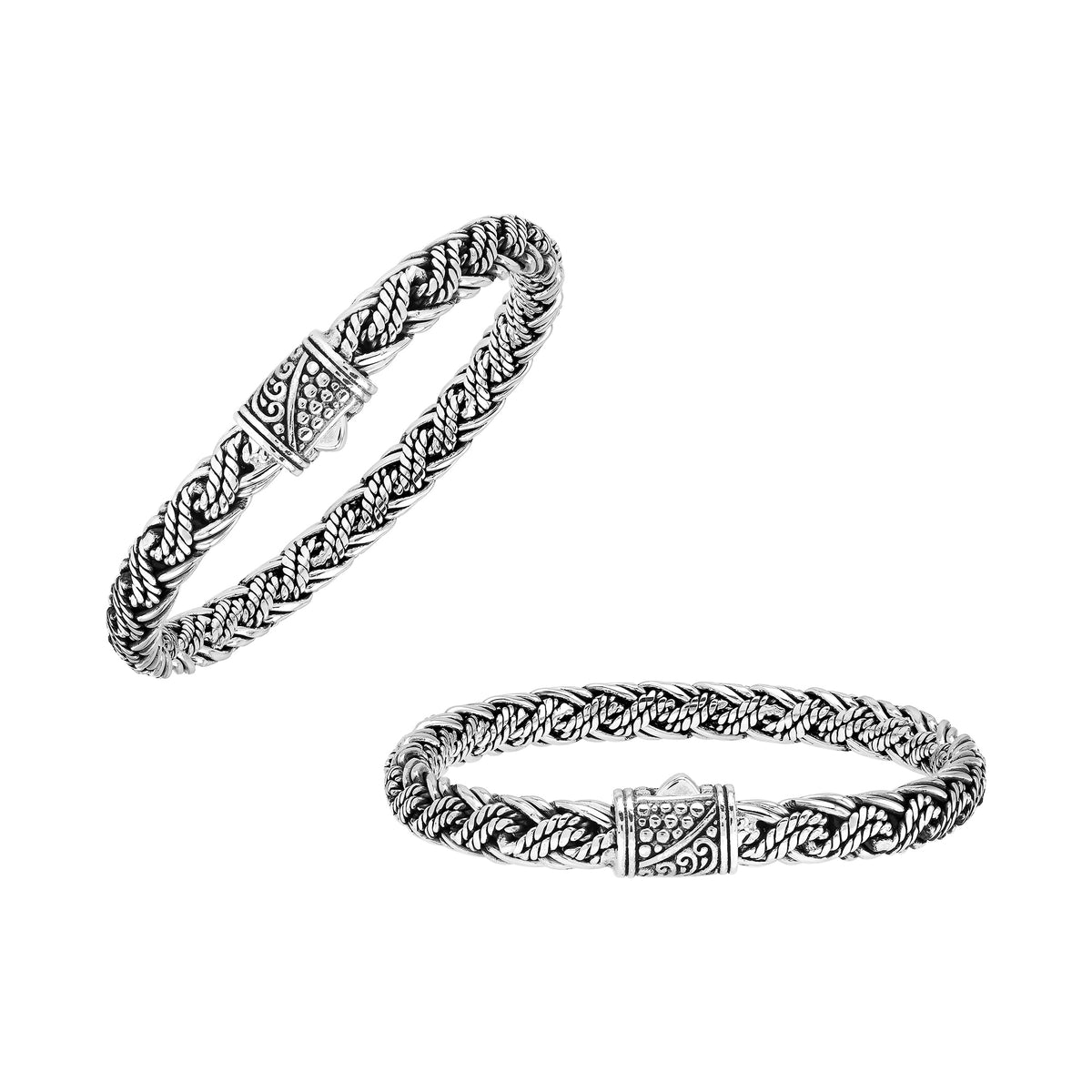 Sterling silver twisted rope chain bracelet featuring wrapped textured links, deep oxidized accents, polished detailing, and an engraved decorative push clasp.