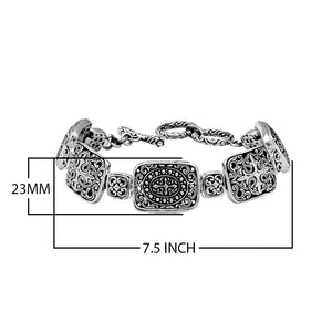 Sterling Silver bracelet featuring rectangular ornate scroll panels, polished connector links, and a secure toggle lock designed for reliable wholesale jewelry assortments.