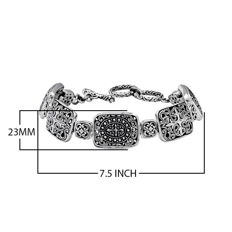 Sterling Silver bracelet featuring rectangular ornate scroll panels, polished connector links, and a secure toggle lock designed for reliable wholesale jewelry assortments.