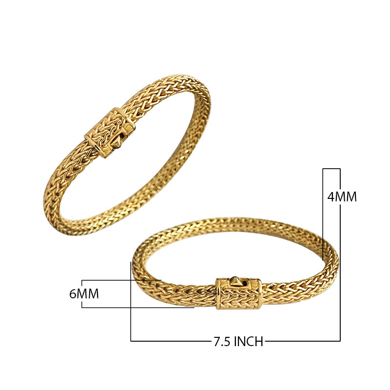 18K gold woven chain bracelet with push clasp lock and polished handcrafted finish.