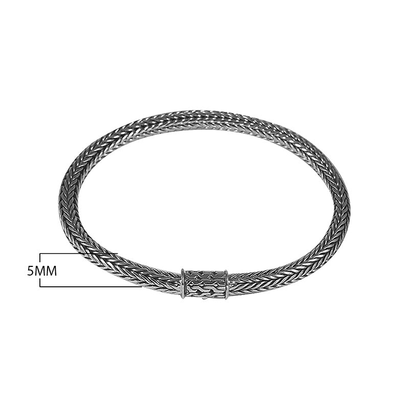 Sterling silver woven bracelet with polished surface and secure push clasp, featuring a classic rounded chain pattern for wholesale supply.