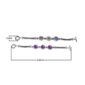 Handcrafted sterling silver bracelet featuring faceted Amethyst Quartz and multi-link circular motifs with a braided chain and toggle lock.