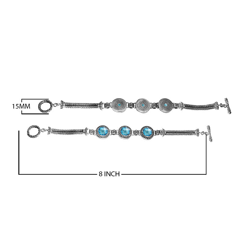Handcrafted sterling silver bracelet with faceted Blue Topaz Quartz, circular artisan motifs, braided chain detailing, and a toggle lock.
