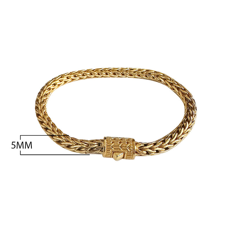 Wholesale 18K gold bracelet featuring a polished 5MM woven Balinese chain with intricate braiding and a secure push clasp ideal for luxury catalog placement.