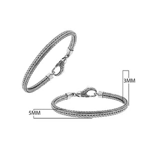 A beautifully crafted sterling silver woven bracelet with a secure lobster clasp, featuring intricate chain detailing and a mirror-polished high-gloss finish for elegant collections.