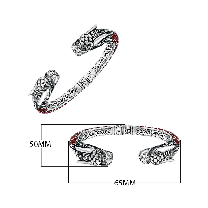 Wholesale sterling silver phoenix-inspired bangle featuring Red Coral accents, ornate Balinese scroll engraving, and a sturdy hinge lock for detailed, artisan-quality wholesale jewelry collections.