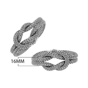 Wholesale sterling silver multi-strand woven knot bangle featuring a thick Balinese-style chain weave and a secure push clasp for premium artisan jewelry displays.