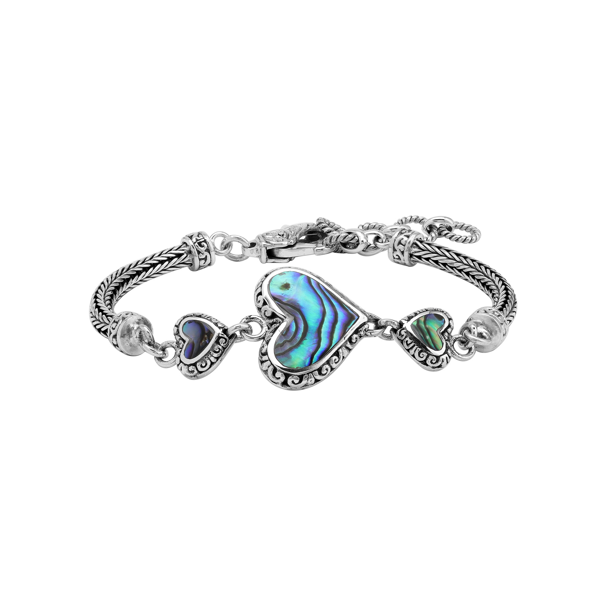 Wholesale sterling silver bracelet featuring Abalone Shell heart links, intricate Balinese decorative detailing, and a secure lobster lock for premium artisan-style jewelry collections.