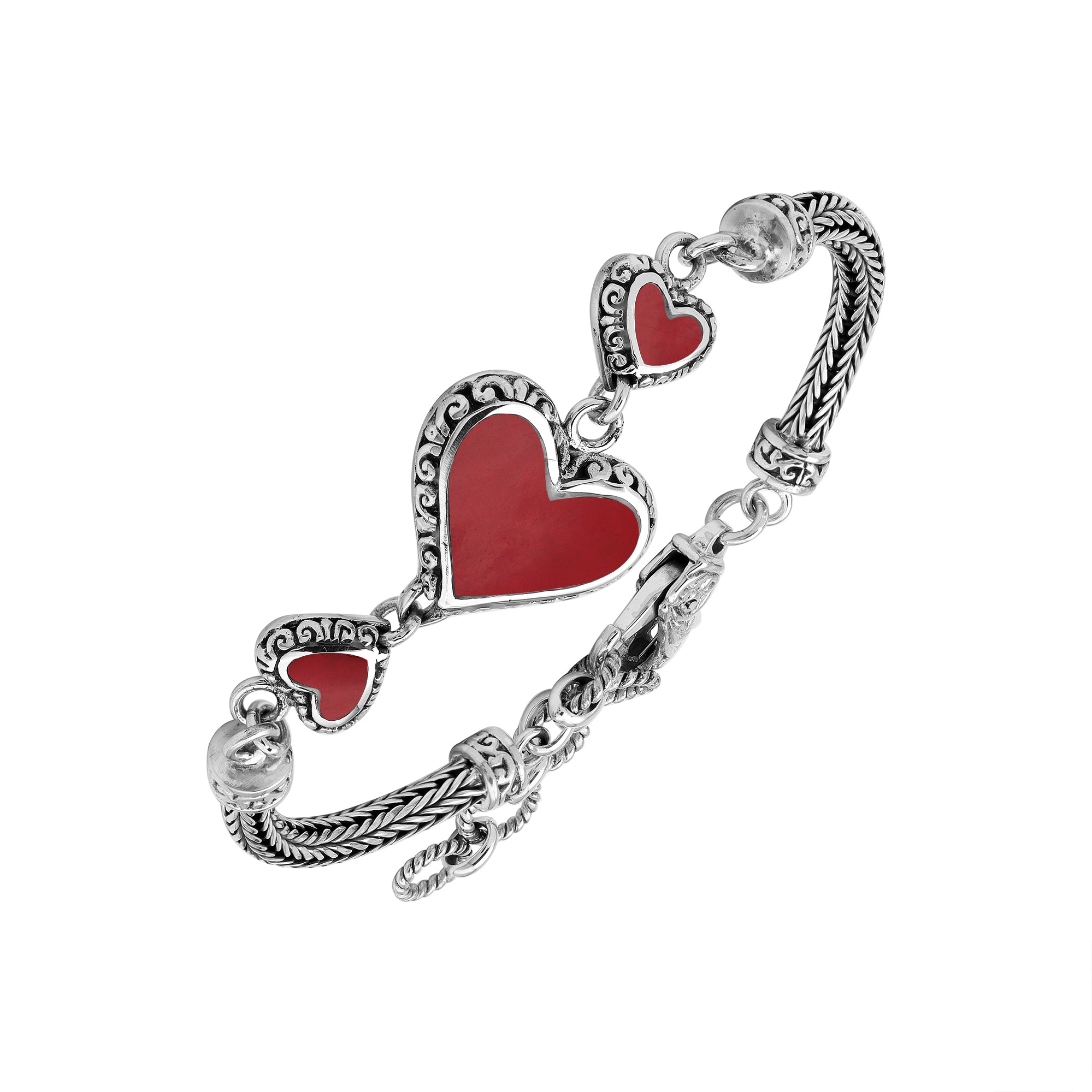 Wholesale sterling silver bracelet featuring Red Coral heart motifs, decorative Balinese detailing, and a secure lobster lock designed for premium artisan-inspired jewelry collections.