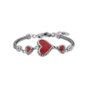 Wholesale sterling silver bracelet featuring Red Coral heart motifs, decorative Balinese detailing, and a secure lobster lock designed for premium artisan-inspired jewelry collections.