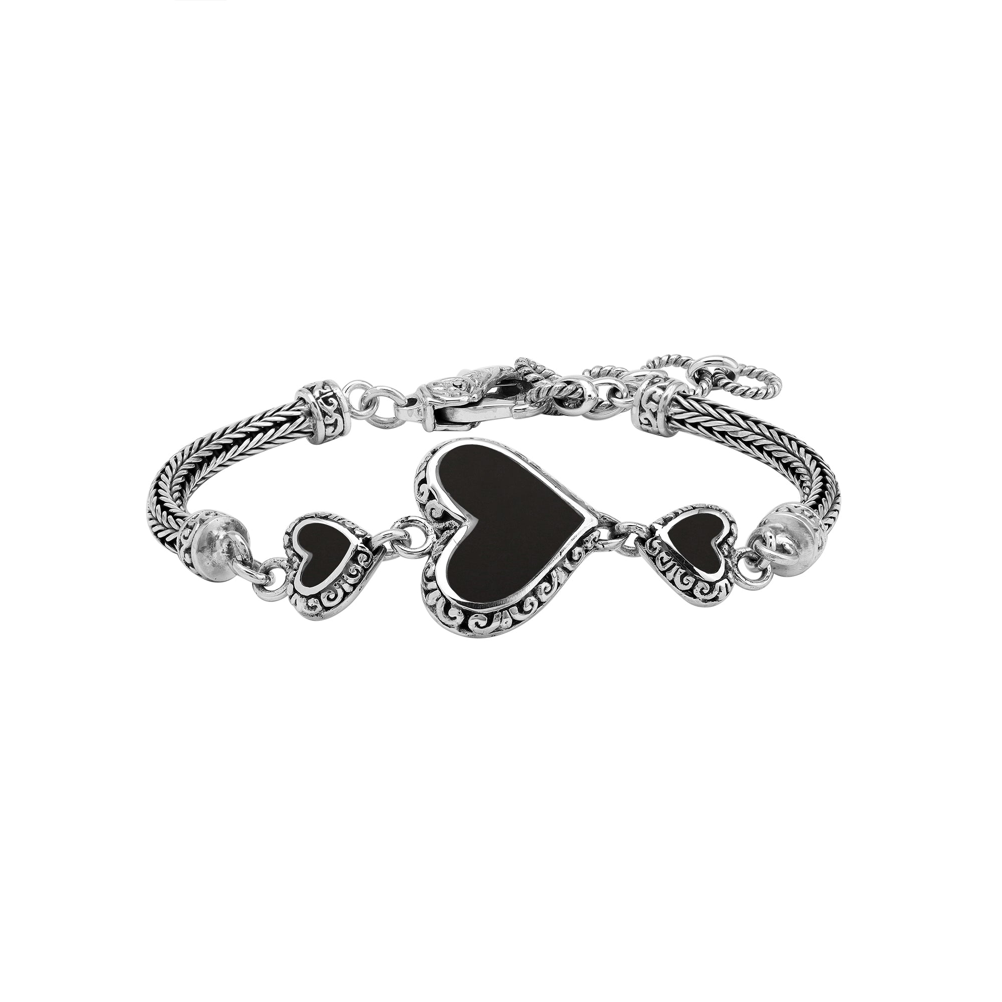 Wholesale sterling silver bracelet featuring Black Shell heart motifs, detailed Balinese ornamental scrollwork, and a secure lobster lock designed for artisan-inspired premium jewelry collections.