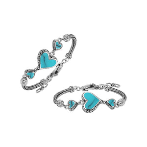 Wholesale sterling silver bracelet featuring Turquoise Shell heart motifs, crafted with intricate Balinese ornamental detailing and secured with a lobster lock for premium artisan-style jewelry collections.
