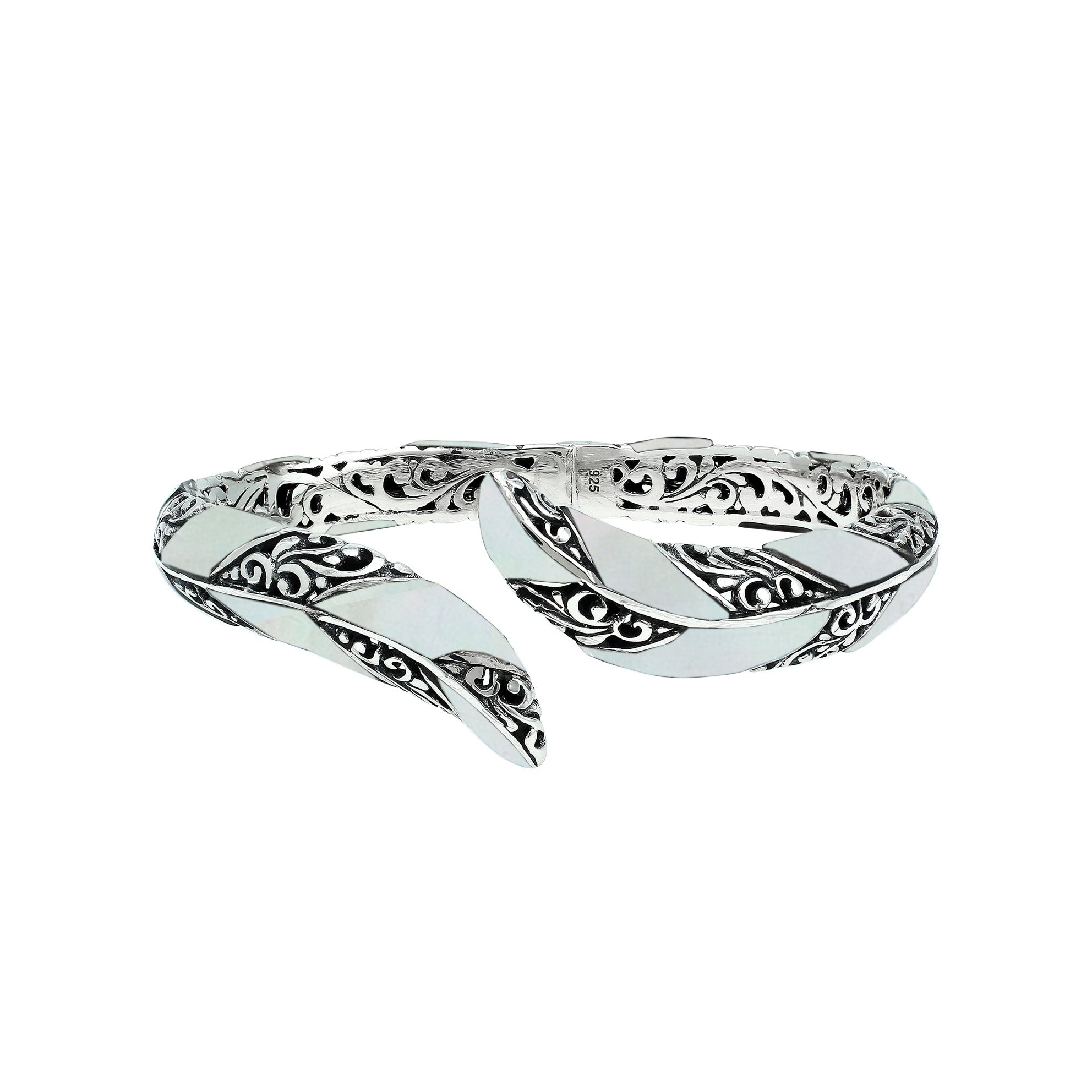 Wholesale sterling silver feather-inspired bangle featuring Mother Of Pearl inlays, ornate Balinese scroll engraving, and a secure hinge lock for premium artisan-style jewelry assortments.