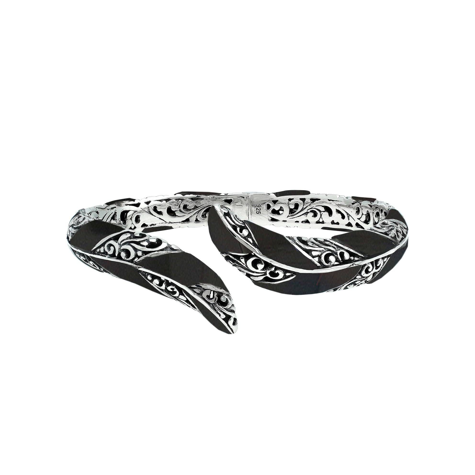 Wholesale sterling silver feather-inspired bangle featuring bold Black Shell inlays, ornate Balinese scroll engraving, and a secure hinge lock for premium artisan-inspired jewelry collections.