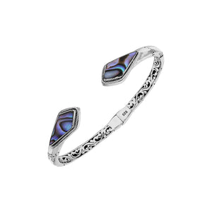 Wholesale sterling silver open bangle featuring Abalone Shell geometric ends, detailed Balinese engravings, and a secure hinge lock for premium artisan-inspired jewelry assortments.