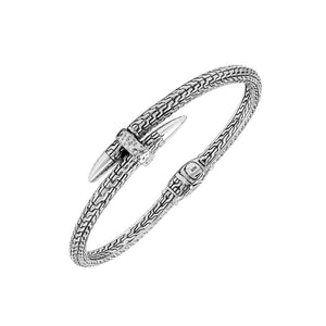 Wholesale sterling silver woven chain bangle featuring a sculpted nail-head design, intricate Balinese engravings, and a secure hinge lock for premium artisan jewelry assortments.