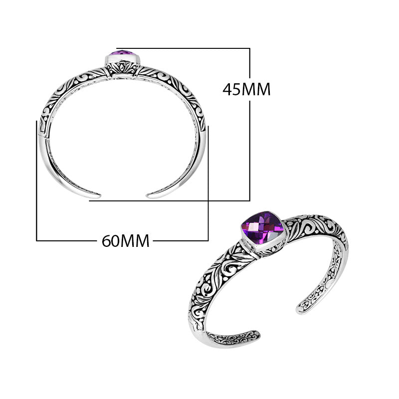 Wholesale sterling silver open bangle featuring a cushion-cut Amethyst Quartz centerpiece, detailed Balinese scroll engravings, and a secure hinge lock for premium artisan jewelry assortments.