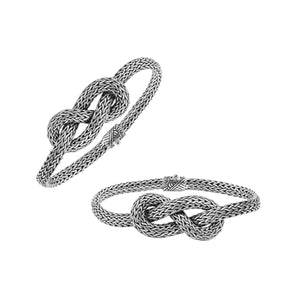 Wholesale sterling silver woven knot bracelet featuring detailed chainwork, oxidized highlights, and a secure push clasp, ideal for premium handcrafted jewelry assortments and boutique suppliers.