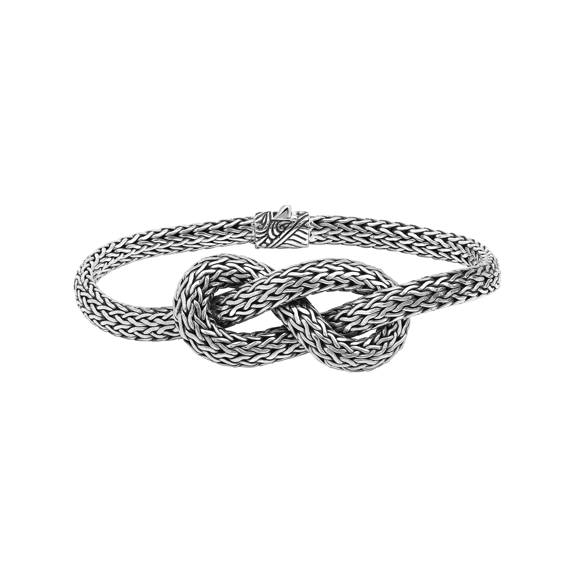 Wholesale sterling silver woven knot bracelet featuring detailed chainwork, oxidized highlights, and a secure push clasp, ideal for premium handcrafted jewelry assortments and boutique suppliers.