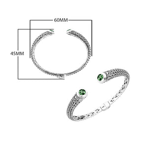 Wholesale sterling silver Bali engraved hinge cuff bracelet featuring vivid green quartz accents and polished–oxidized detailing, crafted for premium wholesale jewelry collections and artistic bulk assortments.