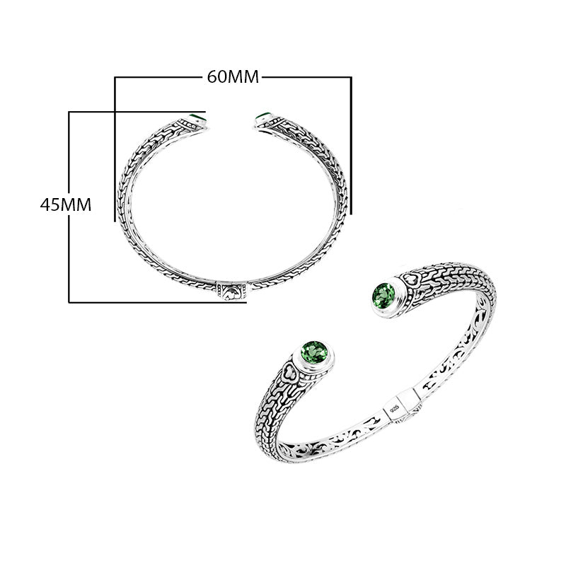 Wholesale sterling silver Bali engraved hinge cuff bracelet featuring vivid green quartz accents and polished–oxidized detailing, crafted for premium wholesale jewelry collections and artistic bulk assortments.