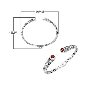 Wholesale sterling silver Bali engraved hinge cuff bracelet featuring vibrant red garnet quartz ends and polished–oxidized detailing, expertly crafted for premium and artistic wholesale jewelry collections.