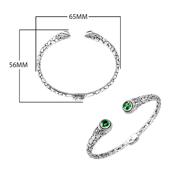 Wholesale sterling silver Bali engraved hinge cuff bracelet featuring radiant green quartz ends with polished–oxidized detailing, designed to enhance premium, modern, and artisan-focused wholesale jewelry lines.