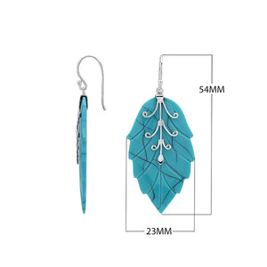 Sterling silver turquoise shell carved leaf drop earrings with polished silver detailing and handcrafted stone design.