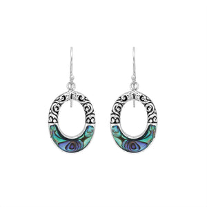 Sterling silver oval drop earrings featuring iridescent Abalone Shell inlay, openwork centers, sculpted scroll detailing, oxidized accents, and classic French ear wires.