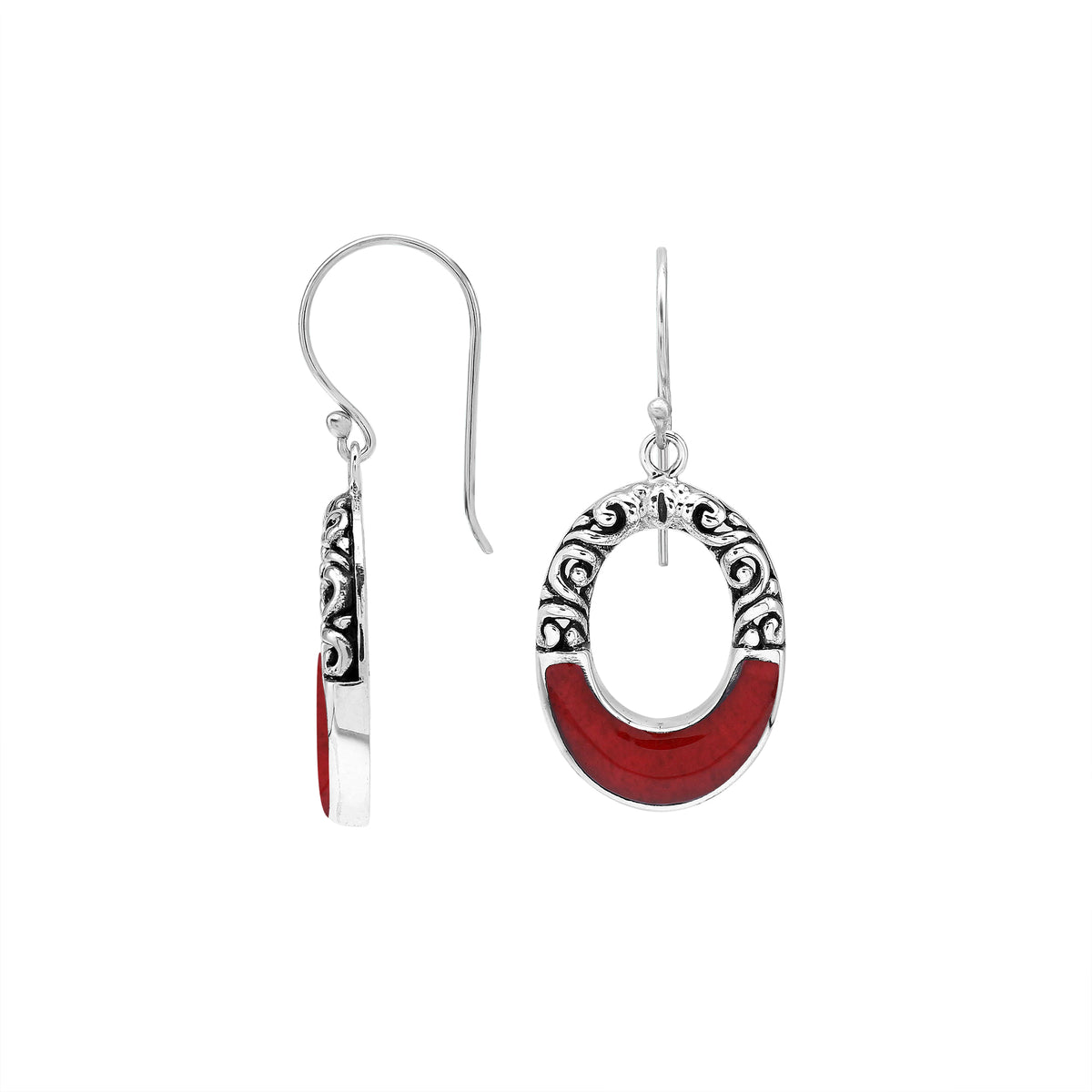 Sterling silver oval drop earrings featuring rich Red Coral inlay, open center design, sculpted scroll motifs, oxidized detailing, polished borders, and French ear wires.