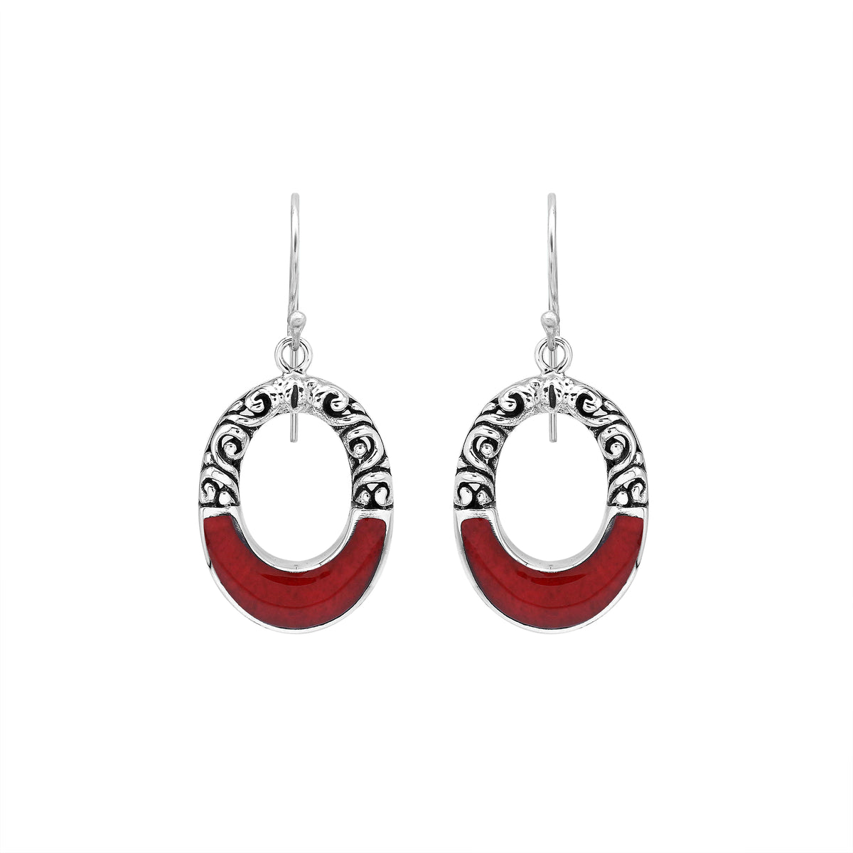 Sterling silver oval drop earrings featuring rich Red Coral inlay, open center design, sculpted scroll motifs, oxidized detailing, polished borders, and French ear wires.