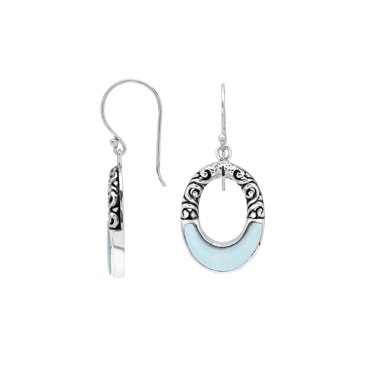 Sterling silver oval drop earrings featuring luminous Mother Of Pearl inlay, open center silhouette, decorative scrollwork, oxidized detailing, polished borders, and French ear wires.