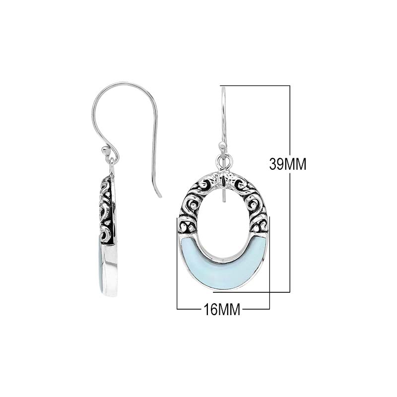 Sterling silver oval drop earrings featuring luminous Mother Of Pearl inlay, open center silhouette, decorative scrollwork, oxidized detailing, polished borders, and French ear wires.