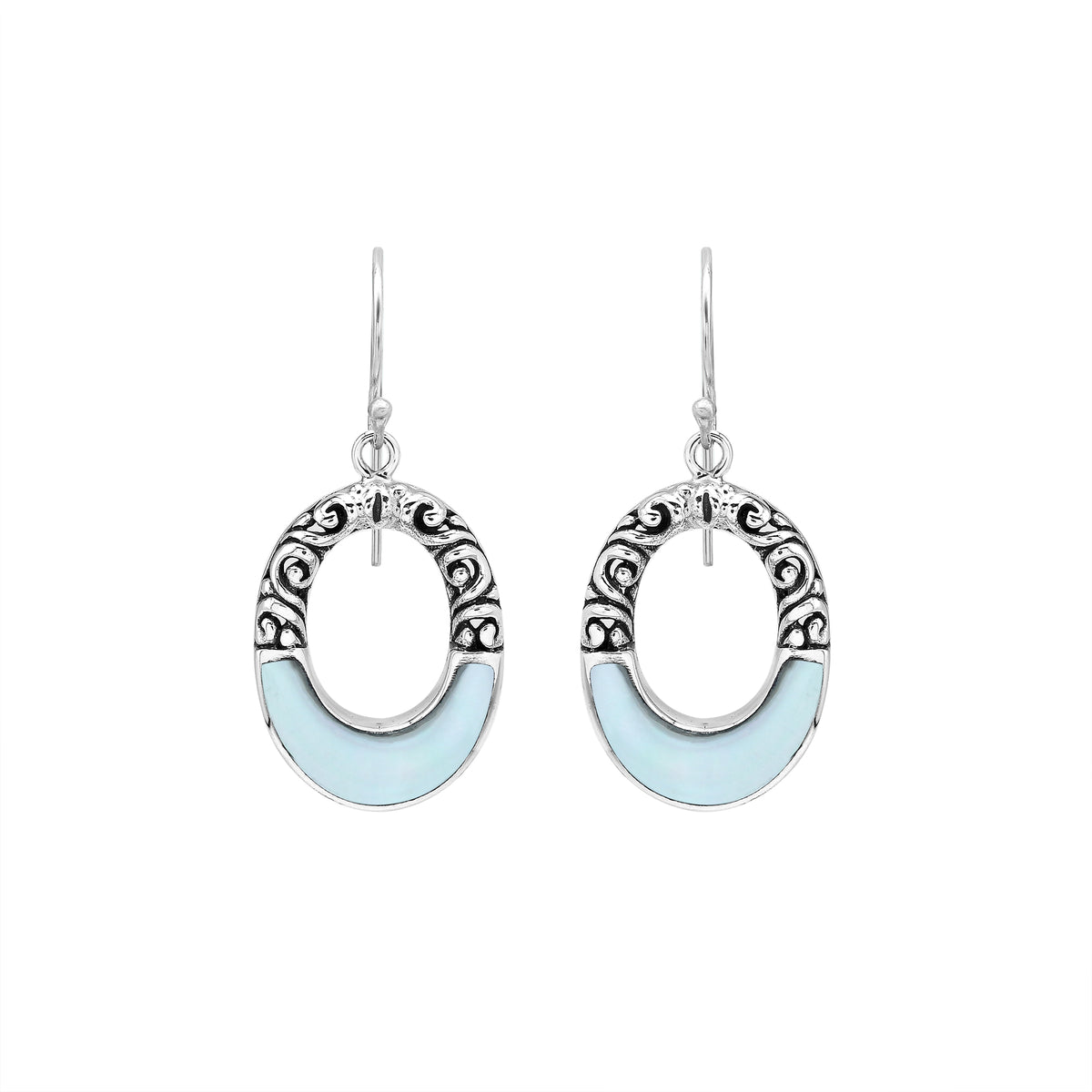 Sterling silver oval drop earrings featuring luminous Mother Of Pearl inlay, open center silhouette, decorative scrollwork, oxidized detailing, polished borders, and French ear wires.