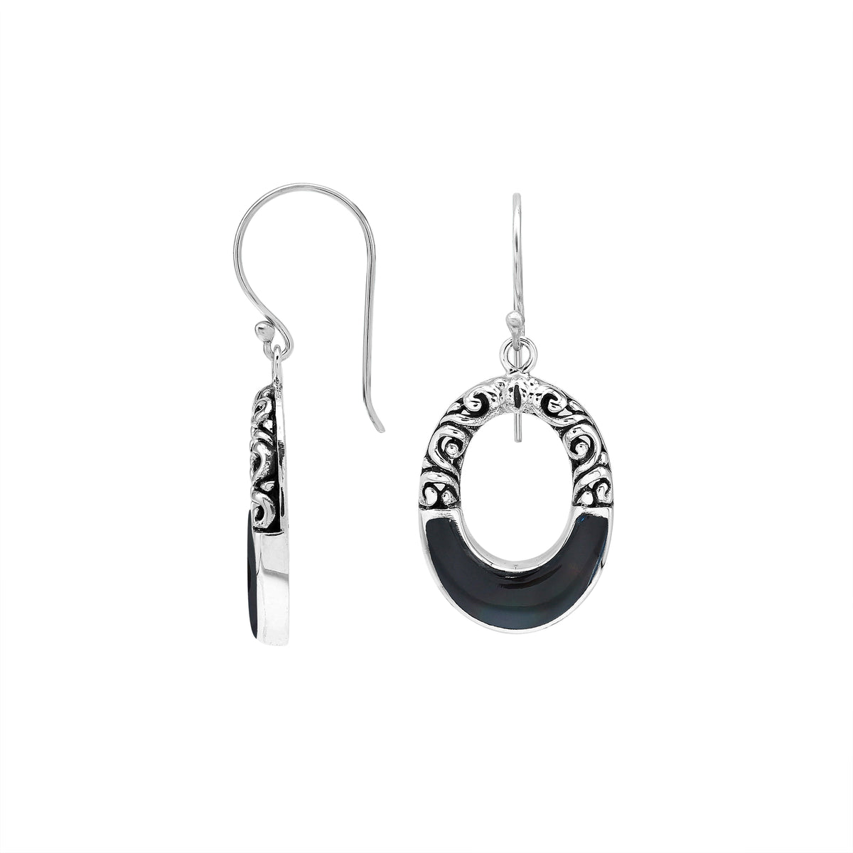 Sterling silver oval drop earrings featuring glossy Black Shell inlay, open center silhouette, sculpted scroll motifs, oxidized detailing, polished borders, and French ear wires.