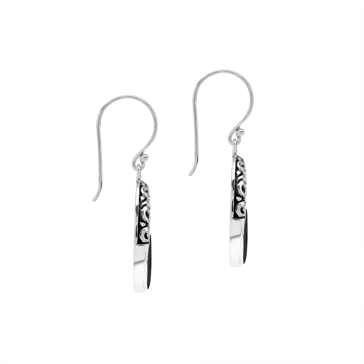 Sterling silver oval drop earrings featuring glossy Black Shell inlay, open center silhouette, sculpted scroll motifs, oxidized detailing, polished borders, and French ear wires.