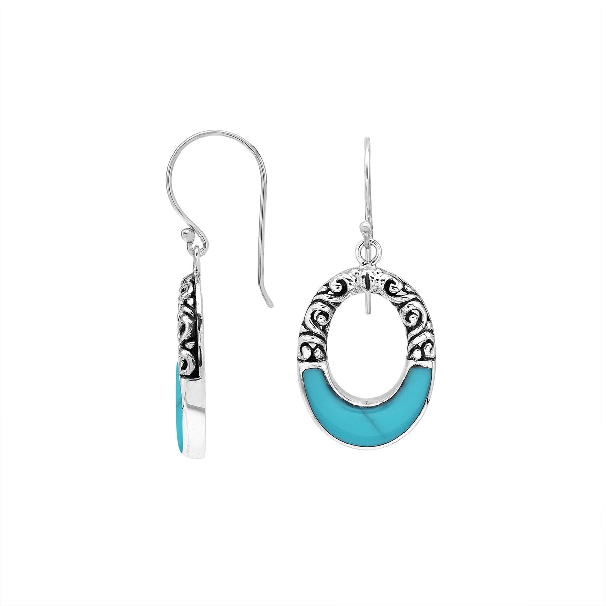 Sterling silver oval drop earrings featuring vibrant Turquoise Shell inlay, open center silhouette, sculpted scroll motifs, oxidized detailing, polished borders, and French ear wires.